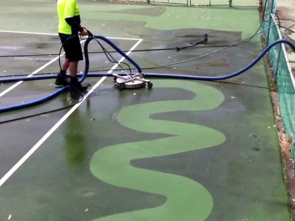 Waterworx rotary cleaning a mould-stained tennis court