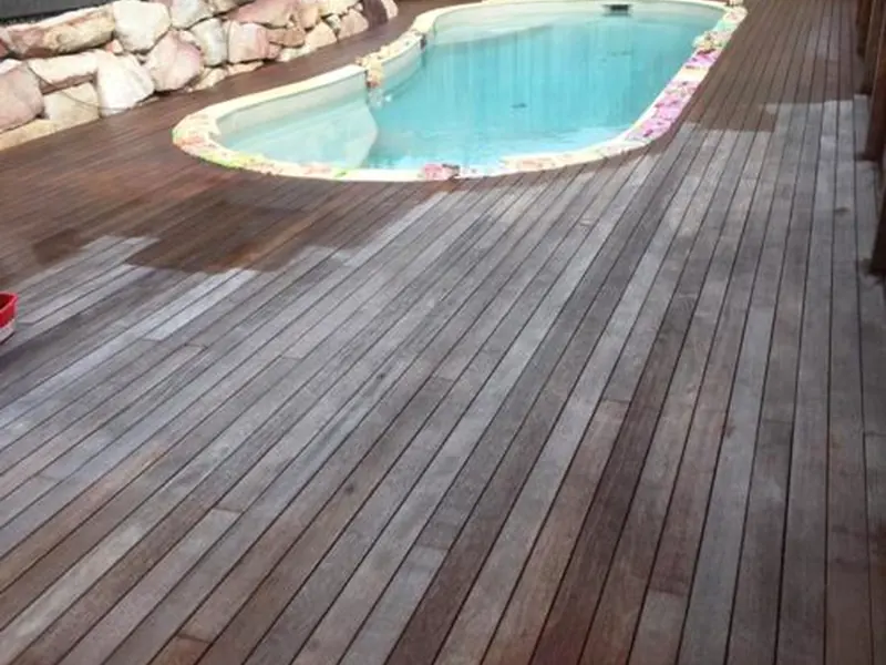 Clean timber deck beside a pool
