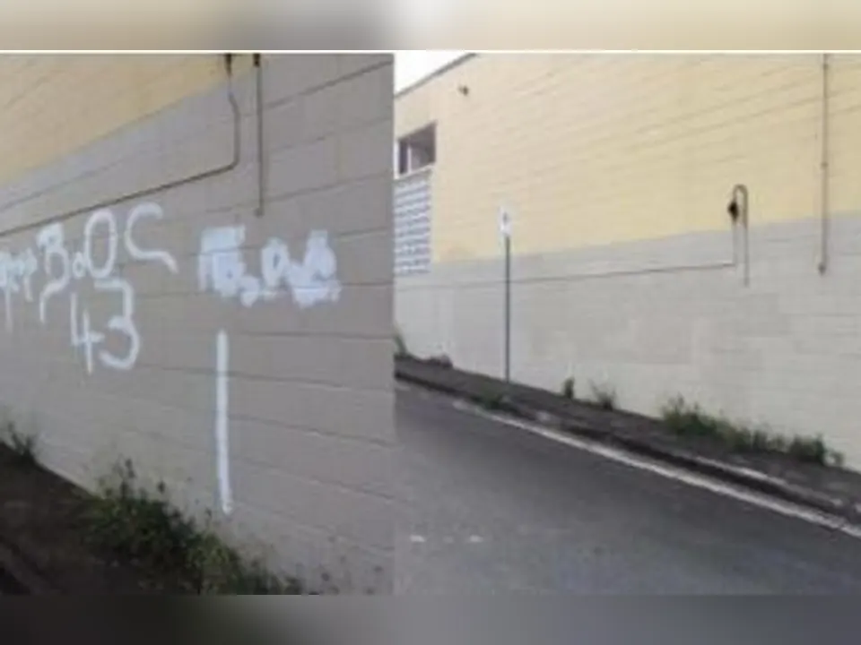 Commercial wall before and after graffiti removal