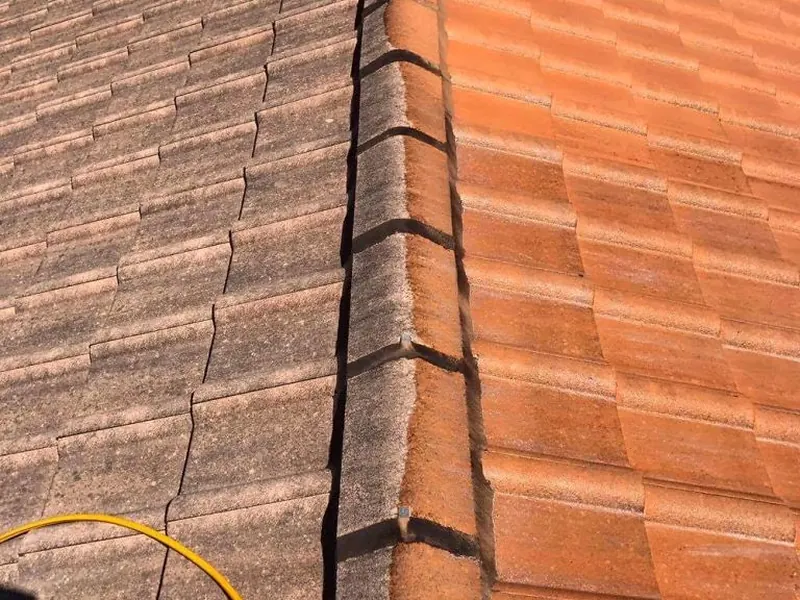 Terracotta tile roof showing the difference during cleaning